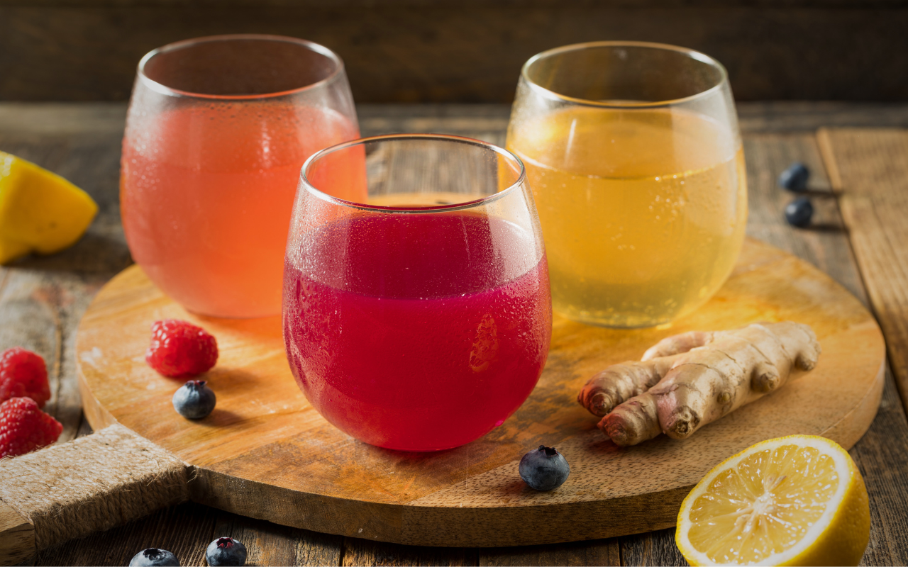 Three glasses of kombucha, various colours