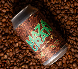 Can of Mazagran Coffee on top of fresh coffee beans, developed by Dispatch Restaurant with the help of FBIC.