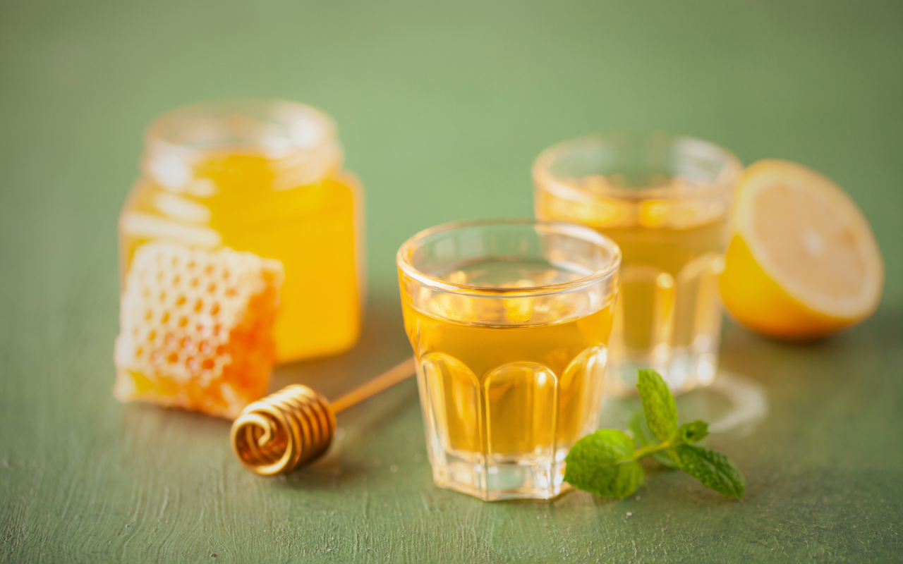 Two glasses of mead surrounded by ingredients